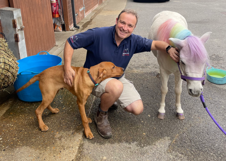 Joe, veterinary surgeon at Sussex Home Vets, with a dog and a pony Joe, veterinary surgeon at Sussex Home Vets, with a dog and a pony